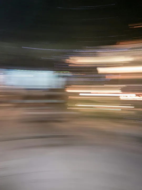 Example photo: a night street spoiled by camera shake.